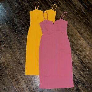 Body fitting mini cami dresses, one yellow and one mauve